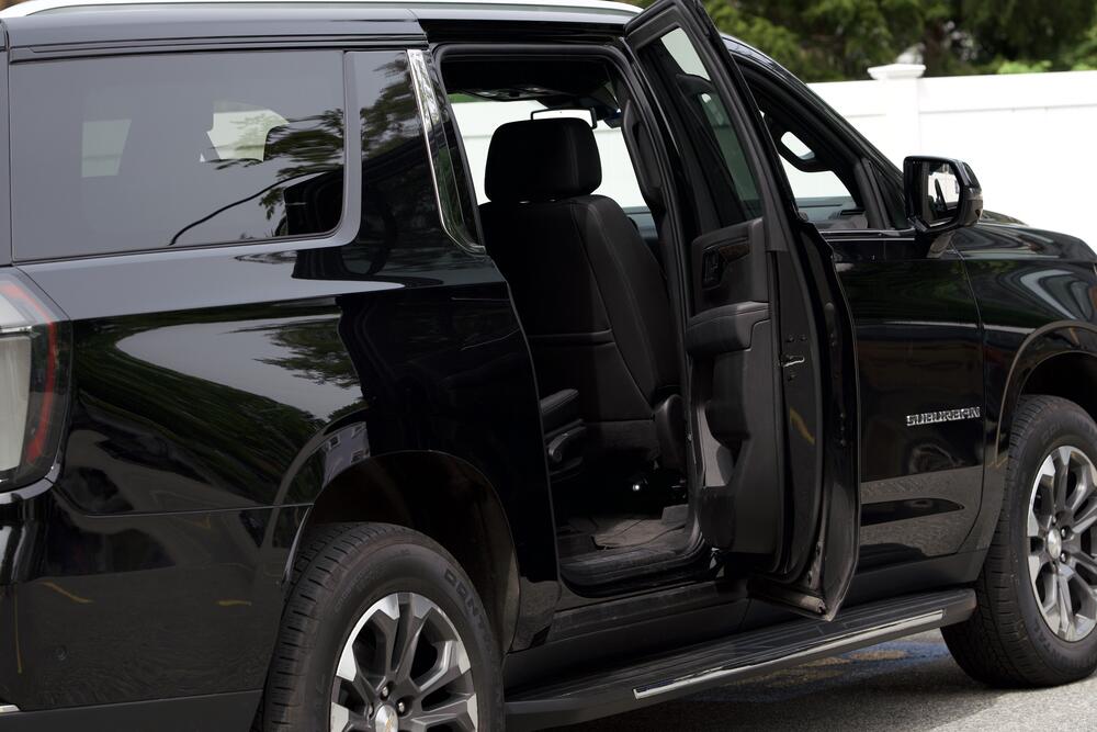 Black SUV with the rear passenger door open